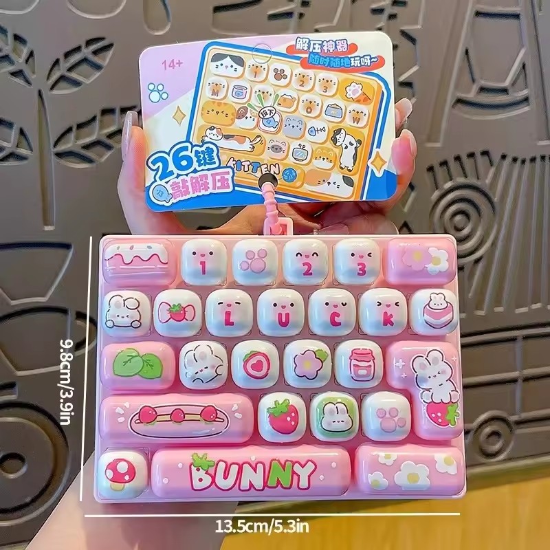 持ち運び可能なスクイッシーキーボード型ストレス解消おもちゃ。 - Japanese Snacks のレビューと価格